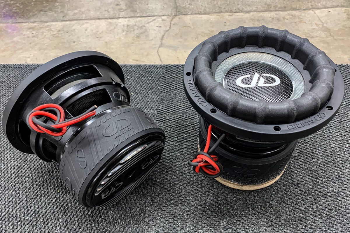 Two USA Made Subwoofers with Ghost Cones, DDA logo in white on carbon fiber dust cap